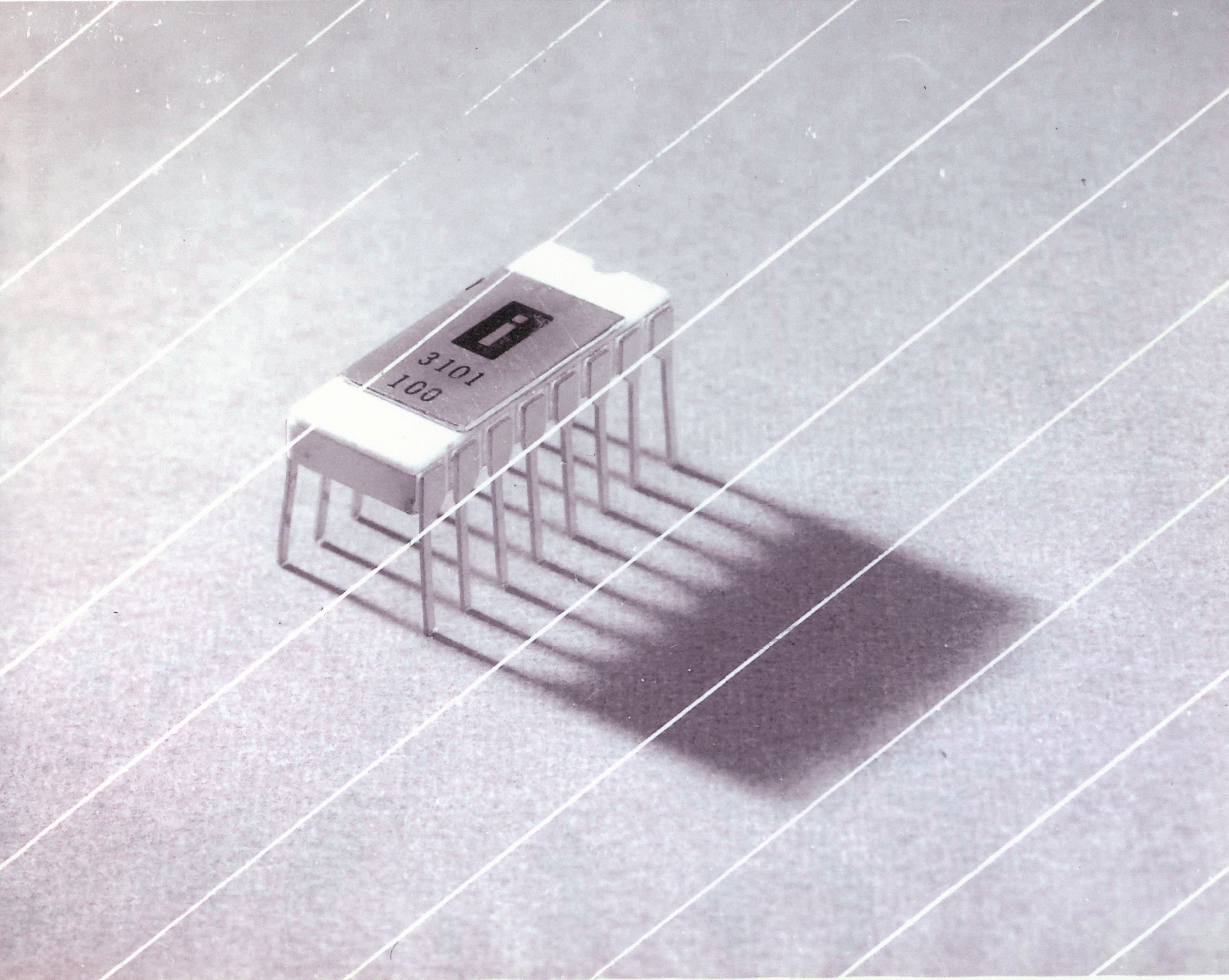 The new semiconductor memory chip, about the size of a pinkie fingernail, rested inside this package, which could be used to connect the chip to other devices. 
